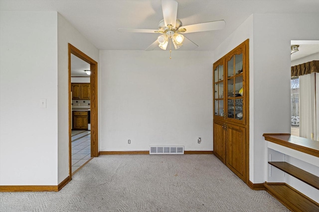2500 S Brookside Pkwy, New Berlin, WI 53151 - interior space featuring baseboards, visible vents, a ceiling fan, and carpet flooring