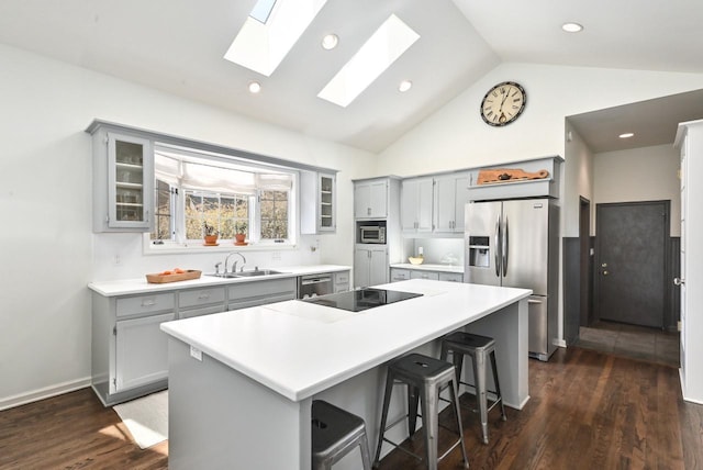 kitchen featuring a sink, gray cabinetry, and stainless steel appliances