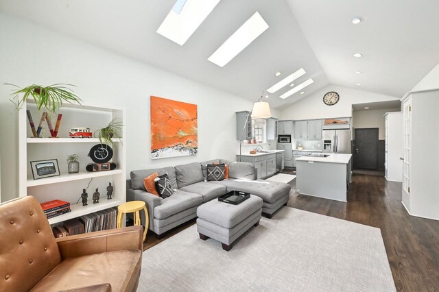 living area with recessed lighting, lofted ceiling with skylight, and dark wood-type flooring
