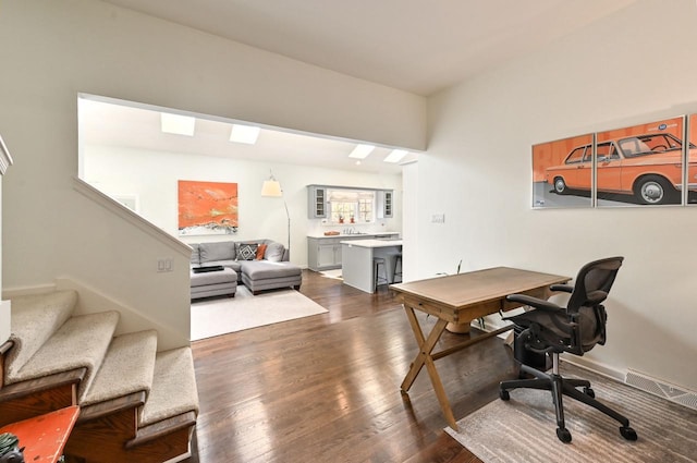 office with visible vents and dark wood finished floors