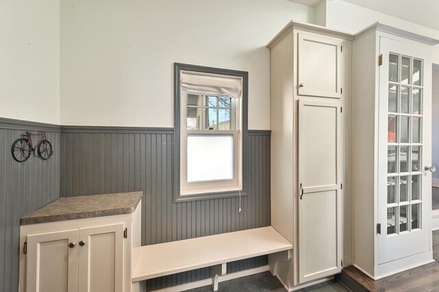 mudroom with a wainscoted wall
