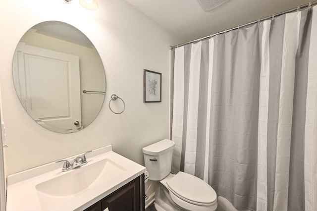 bathroom with vanity, a shower with shower curtain, toilet, and visible vents