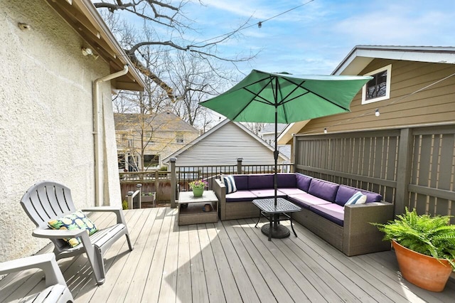 wooden terrace featuring outdoor lounge area
