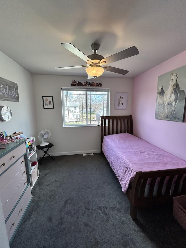 511 Madison St Unit 511, Sauk City, WI 53583 - bedroom featuring ceiling fan, dark colored carpet, and baseboards