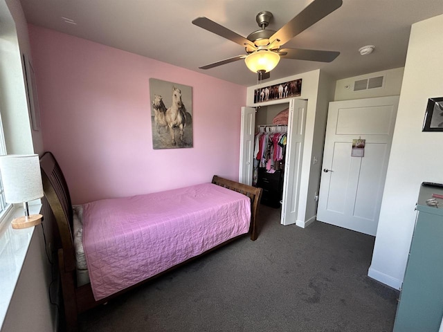 511 Madison St Unit 511, Sauk City, WI 53583 - bedroom with a closet, visible vents, dark carpet, and baseboards