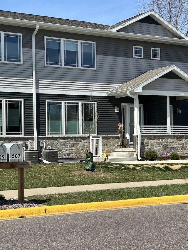 511 Madison St Unit 511, Sauk City, WI 53583 - view of property featuring cooling unit and stone siding