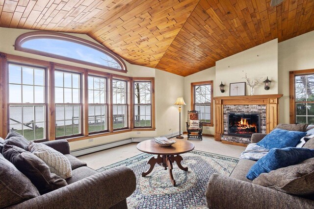 2108 Woodlawn Ln, Appleton, WI 54914 - carpeted living room with a baseboard heating unit, a brick fireplace, a water view, a healthy amount of sunlight, and vaulted ceiling