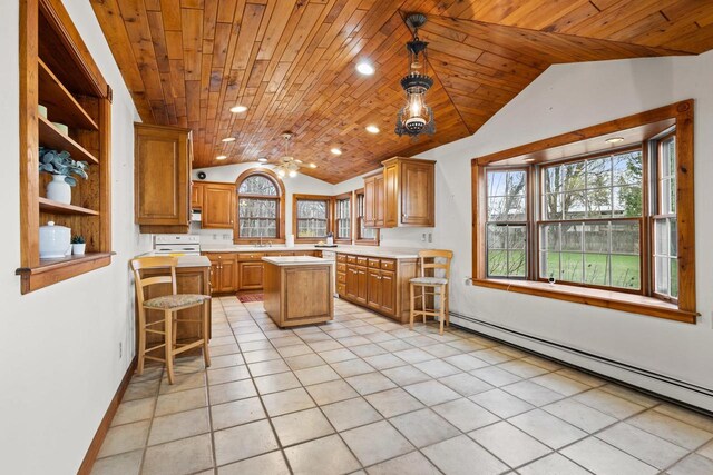 2108 Woodlawn Ln, Appleton, WI 54914 - kitchen featuring wooden ceiling, a wealth of natural light, vaulted ceiling, light countertops, and a baseboard radiator