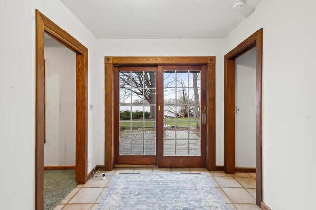 2108 Woodlawn Ln, Appleton, WI 54914 - doorway with a water view and baseboards