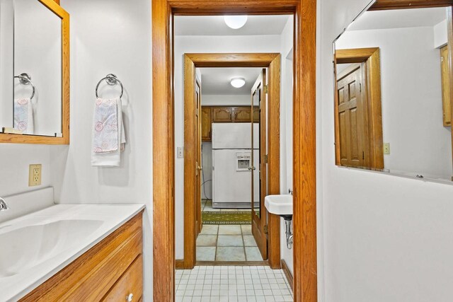 2108 Woodlawn Ln, Appleton, WI 54914 - bathroom featuring tile patterned floors and vanity