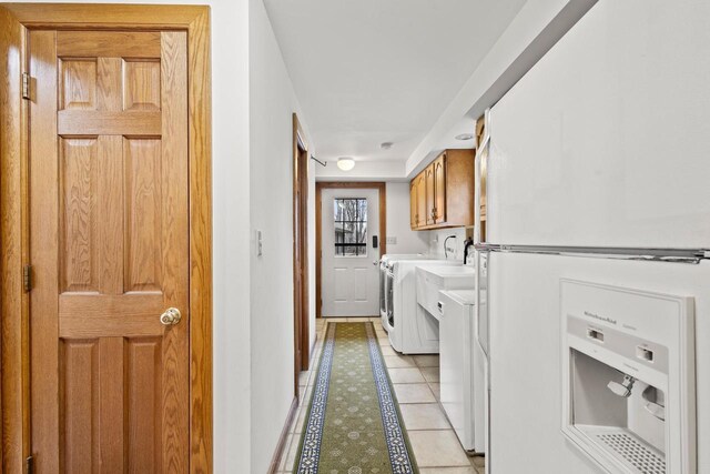 2108 Woodlawn Ln, Appleton, WI 54914 - clothes washing area with light tile patterned floors, washer and dryer, and cabinet space