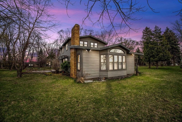 2108 Woodlawn Ln, Appleton, WI 54914 - back of house with a yard and a chimney