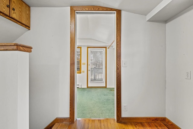 2108 Woodlawn Ln, Appleton, WI 54914 - hall featuring baseboards, wood finished floors, lofted ceiling, and a baseboard radiator