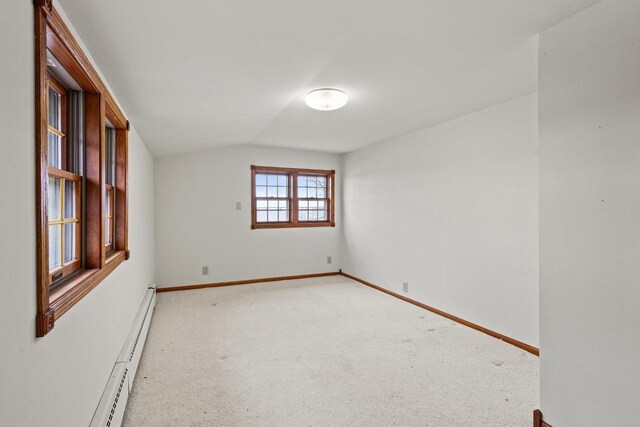 2108 Woodlawn Ln, Appleton, WI 54914 - unfurnished room featuring baseboards, light colored carpet, lofted ceiling, and a baseboard radiator