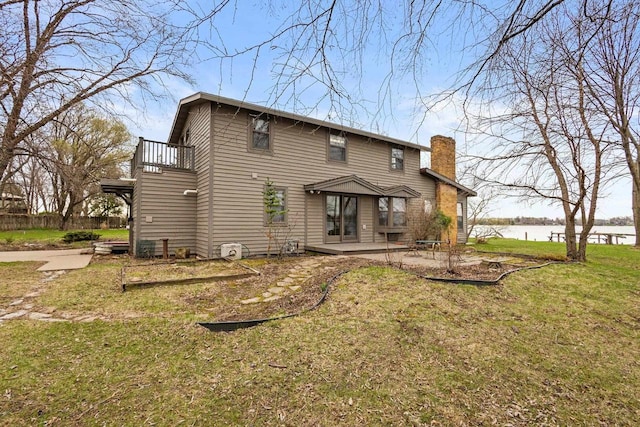2108 Woodlawn Ln, Appleton, WI 54914 - rear view of property featuring a balcony, a patio, a chimney, a water view, and a yard
