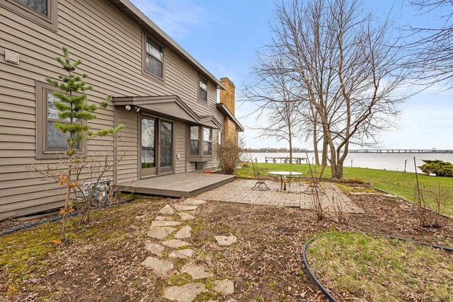 2108 Woodlawn Ln, Appleton, WI 54914 - view of yard with a deck with water view and a patio area