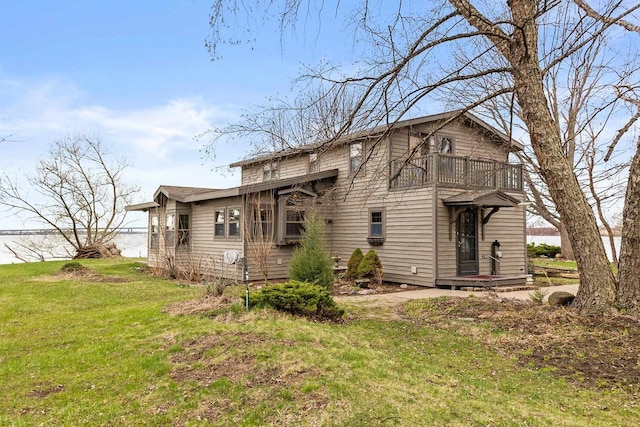2108 Woodlawn Ln, Appleton, WI 54914 - back of house featuring a lawn and a balcony