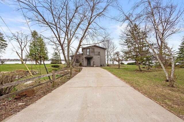 2108 Woodlawn Ln, Appleton, WI 54914 - view of property's community with fence, a yard, and concrete driveway