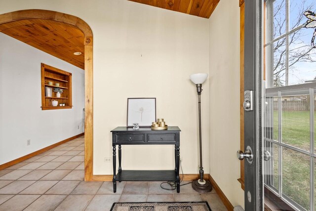 2108 Woodlawn Ln, Appleton, WI 54914 - entryway featuring wood ceiling, a wealth of natural light, light tile patterned flooring, and baseboards