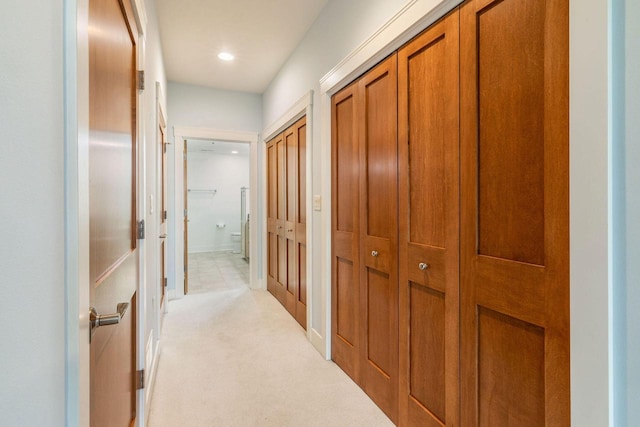 hall featuring recessed lighting and light carpet