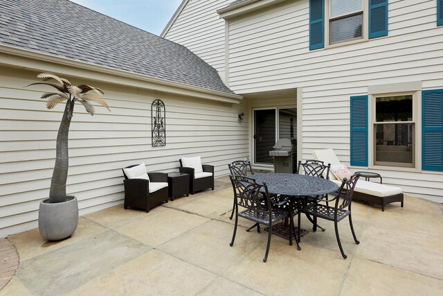 view of patio featuring outdoor dining area