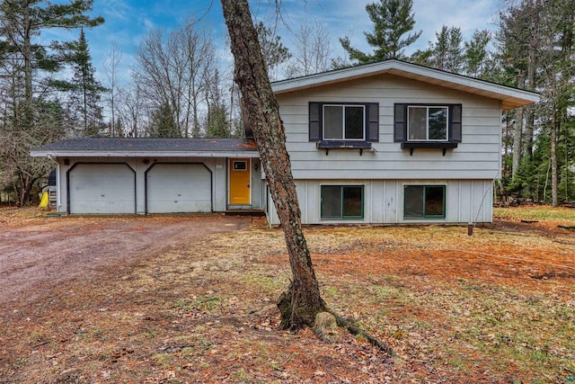 10749 N Namekagon Ln, Hayward, WI 54843 - split level home with a garage and dirt driveway