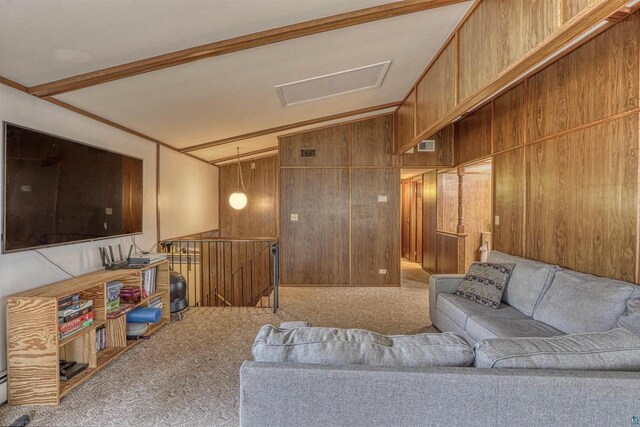 10749 N Namekagon Ln, Hayward, WI 54843 - carpeted living area featuring visible vents, wood walls, attic access, and vaulted ceiling