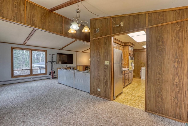 10749 N Namekagon Ln, Hayward, WI 54843 - kitchen featuring appliances with stainless steel finishes, brown cabinets, light carpet, visible vents, and wooden walls