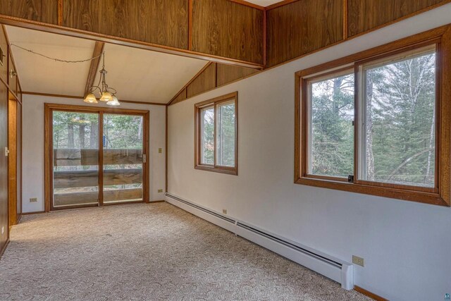 10749 N Namekagon Ln, Hayward, WI 54843 - carpeted spare room featuring baseboards, a baseboard heating unit, lofted ceiling, and an inviting chandelier