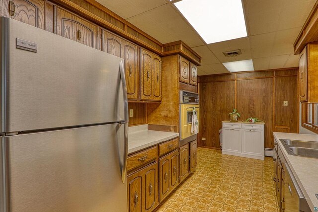 10749 N Namekagon Ln, Hayward, WI 54843 - kitchen featuring brown cabinetry, visible vents, stainless steel appliances, and light countertops