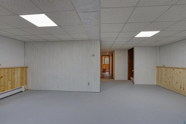 10749 N Namekagon Ln, Hayward, WI 54843 - finished basement featuring a paneled ceiling, baseboard heating, stairway, and wood walls