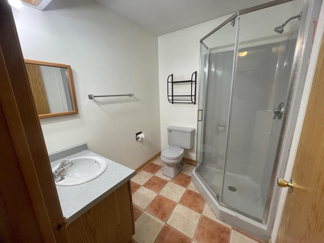 full bath with toilet, a shower stall, and vanity
