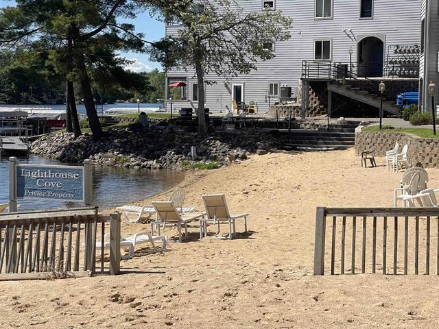 view of community with stairway and a water view