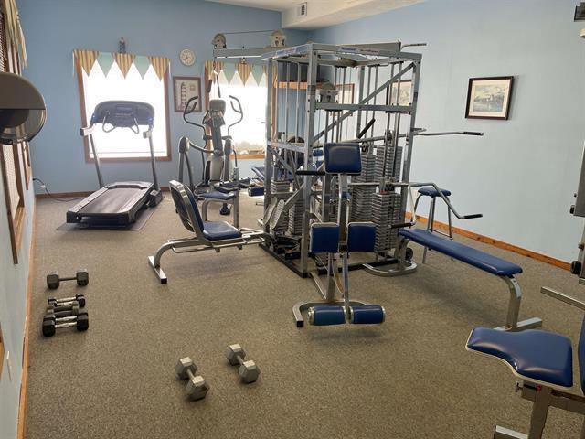 gym featuring visible vents and baseboards