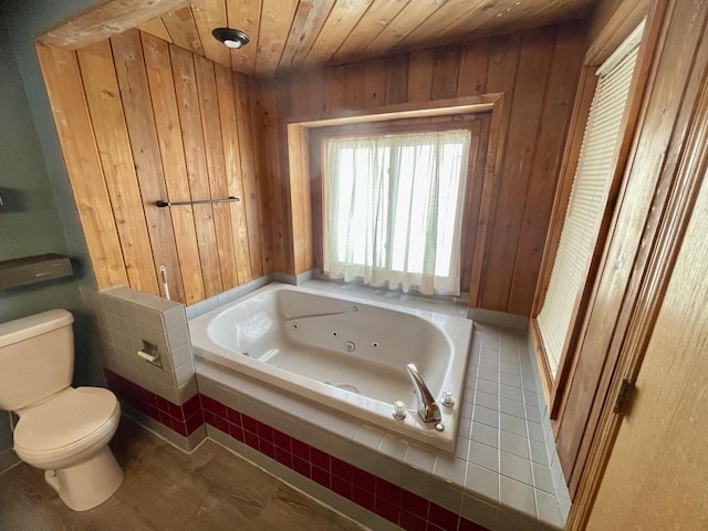 full bath featuring wood ceiling, wooden walls, toilet, and a tub with jets