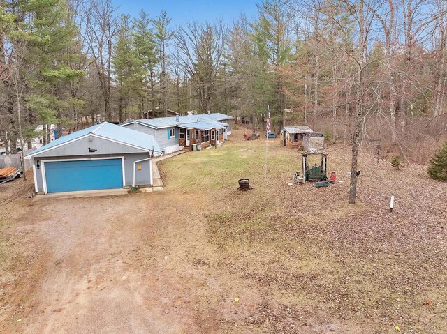 11689 Eagle Bluff Ln, Crivitz, WI 54114 - view of yard featuring an outdoor structure, dirt driveway, and an attached garage