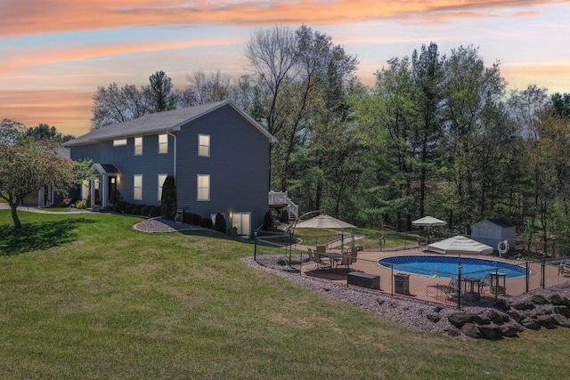 911 Fawn Ct, Wisconsin Dells, WI 53965 - view of swimming pool with a patio, an outbuilding, and a storage unit