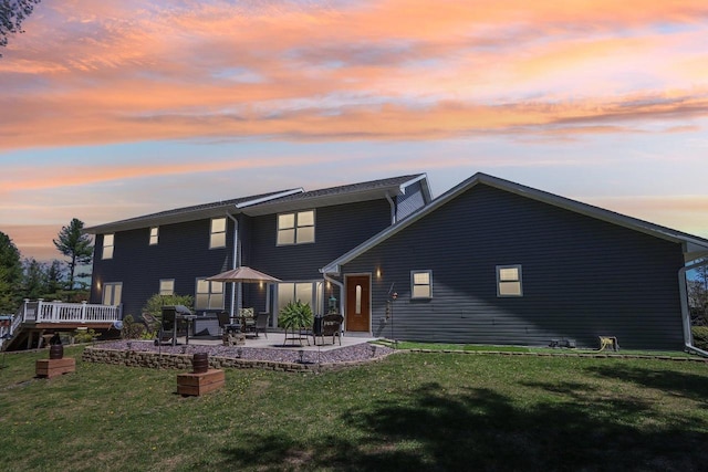 911 Fawn Ct, Wisconsin Dells, WI 53965 - back of house featuring a patio area, a yard, and a wooden deck