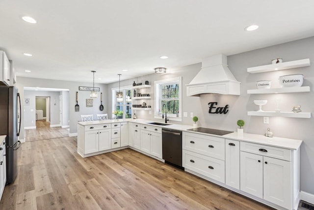 911 Fawn Ct, Wisconsin Dells, WI 53965 - kitchen with open shelves, stainless steel appliances, a sink, custom exhaust hood, and recessed lighting