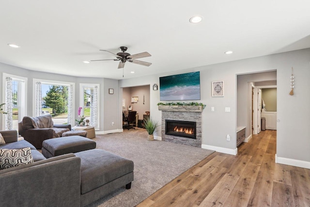 911 Fawn Ct, Wisconsin Dells, WI 53965 - living area with recessed lighting, baseboards, a ceiling fan, a fireplace, and light wood finished floors