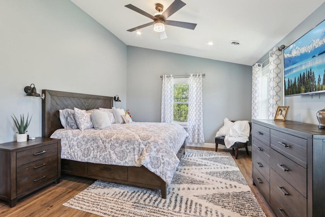 911 Fawn Ct, Wisconsin Dells, WI 53965 - bedroom with vaulted ceiling, wood finished floors, and a ceiling fan