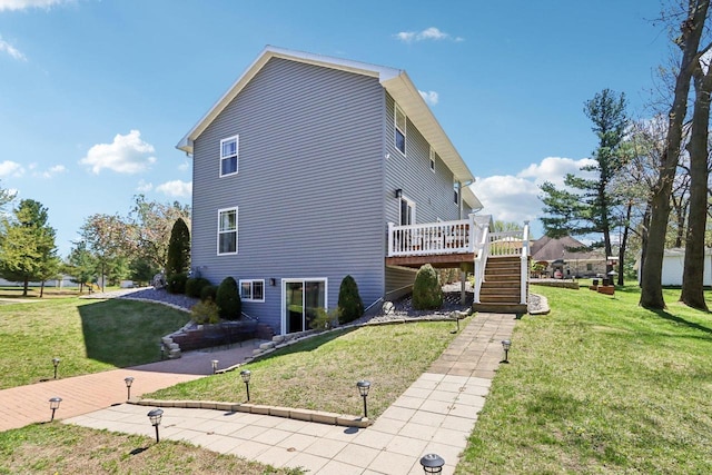 911 Fawn Ct, Wisconsin Dells, WI 53965 - view of property exterior featuring stairs, a wooden deck, and a yard