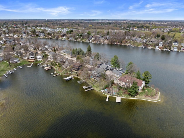 bird's eye view featuring a water view and a residential view