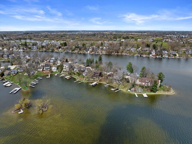 aerial view featuring a residential view and a water view