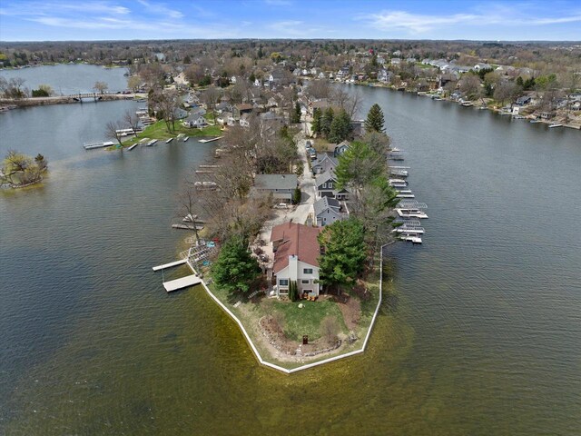 bird's eye view with a residential view and a water view