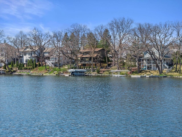 water view featuring stairway and a residential view