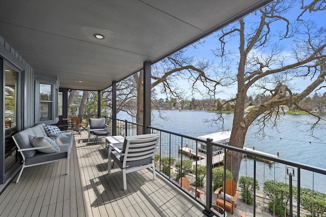 deck featuring a water view and an outdoor hangout area