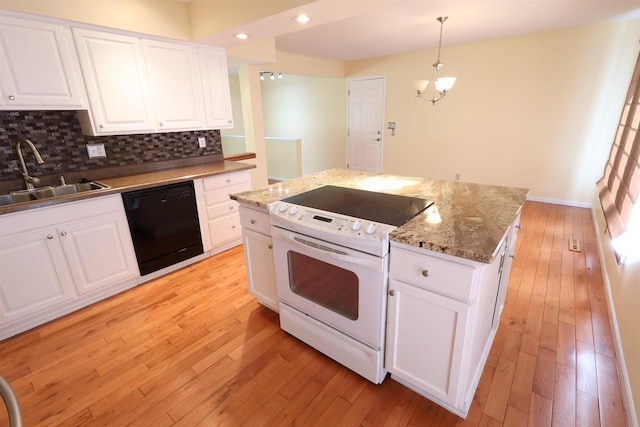 kitchen featuring tasteful backsplash, white range with electric cooktop, dishwasher, a sink, and light wood-type flooring