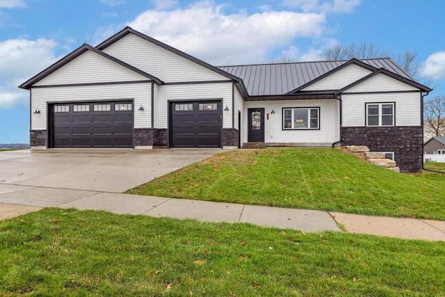 modern inspired farmhouse with concrete driveway, stone siding, a standing seam roof, a front lawn, and a garage