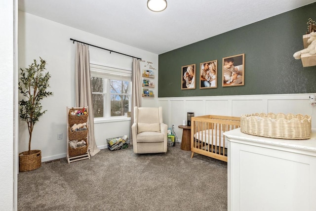 bedroom with wainscoting and carpet floors